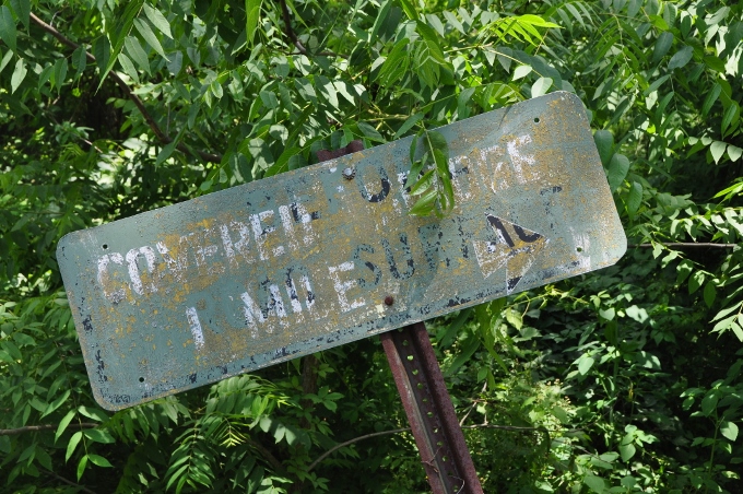 sign to covered bridge